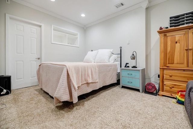 bedroom featuring crown molding and light carpet