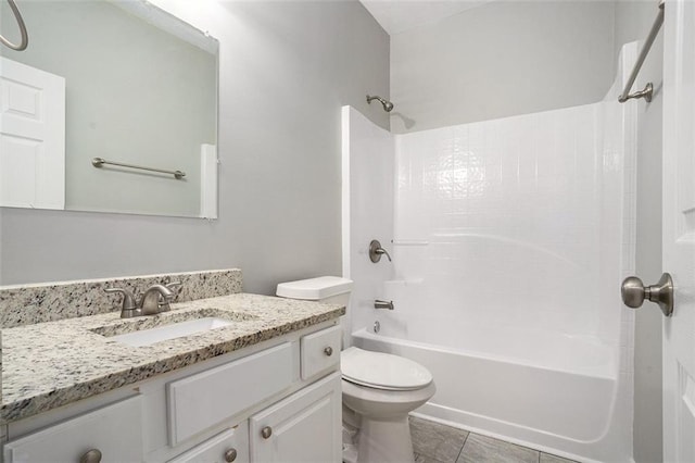 bathroom with tile patterned flooring, tub / shower combination, toilet, and vanity