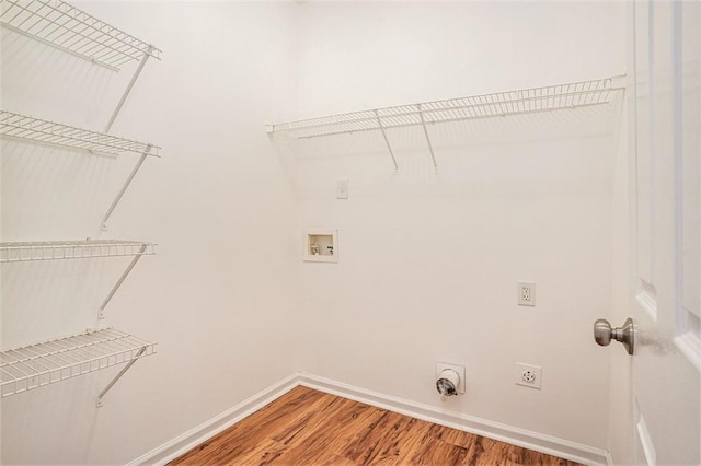 laundry room with baseboards, laundry area, hookup for a washing machine, light wood-style flooring, and electric dryer hookup