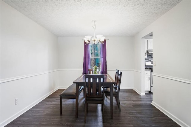 dining area with dark hardwood / wood-style floors, an inviting chandelier, and a textured ceiling