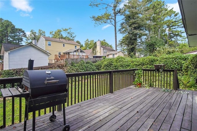 wooden deck featuring grilling area