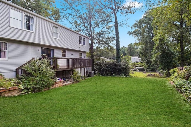 view of yard featuring a wooden deck