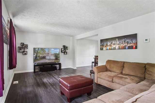 living room featuring a textured ceiling and hardwood / wood-style flooring