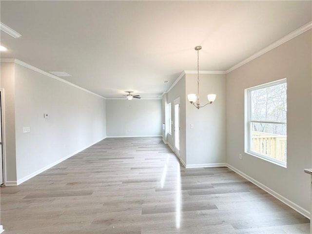 unfurnished dining area featuring baseboards, ornamental molding, light wood-style flooring, and ceiling fan with notable chandelier