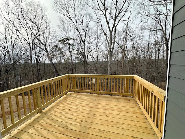 deck featuring a wooded view