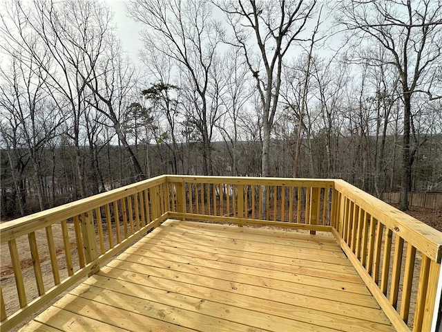 wooden deck featuring a wooded view