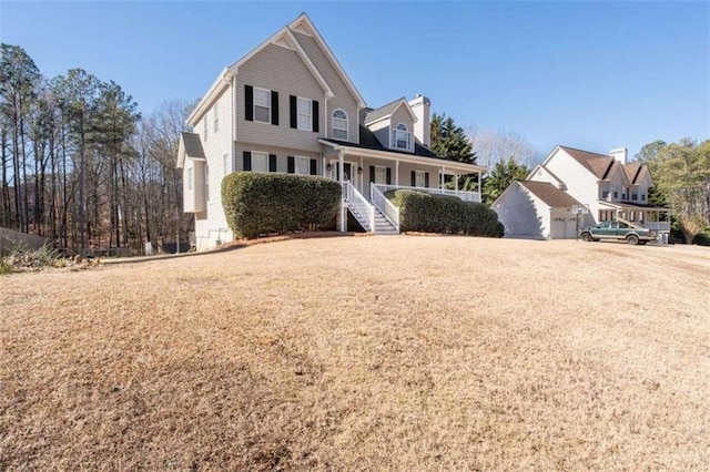 front of property featuring a garage and covered porch