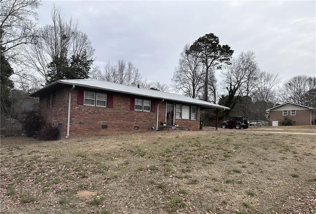 single story home featuring a carport