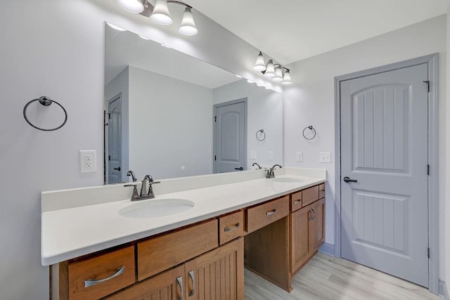 bathroom featuring wood-type flooring and vanity