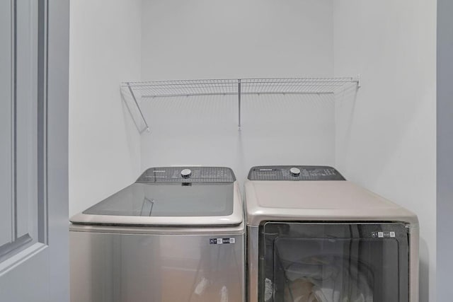 laundry area with separate washer and dryer