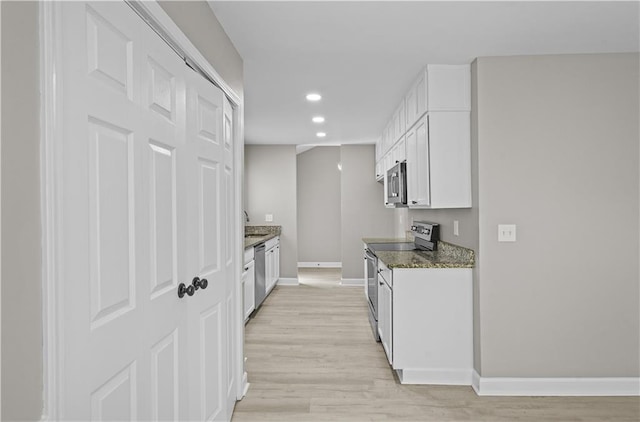 1819 Laurel Ridge Dr SW, Conyers, GA 30094 - kitchen with appliances with stainless steel finishes, recessed lighting, white cabinetry, baseboards, and a sink
