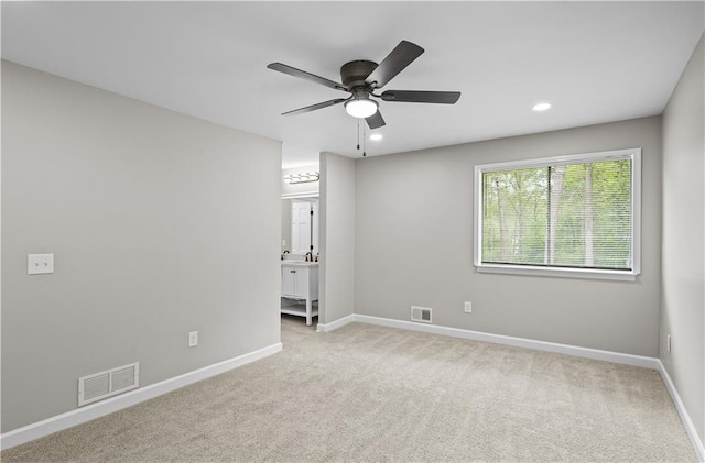 1819 Laurel Ridge Dr SW, Conyers, GA 30094 - spare room featuring a ceiling fan, carpet, baseboards, and recessed lighting