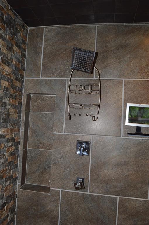 details with a tile shower