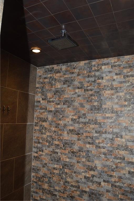 room details with visible vents and tiled shower