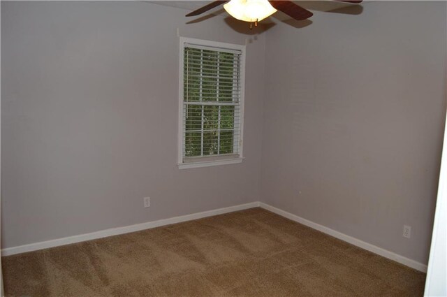 unfurnished room with baseboards, a ceiling fan, and carpet flooring