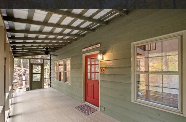 entrance to property with ceiling fan