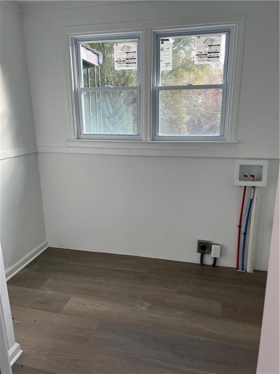 spare room featuring dark hardwood / wood-style floors