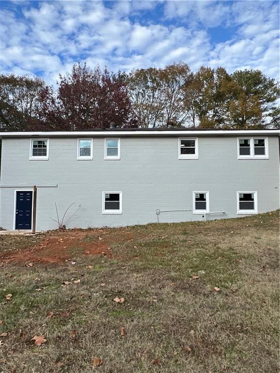 view of property exterior with a yard