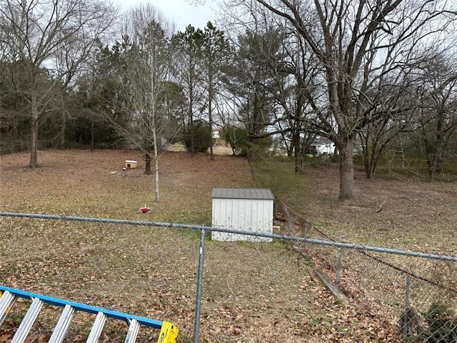 2195 Wilson Rd, Conyers, GA 30012 - view of yard featuring a shed, an outbuilding, and fence