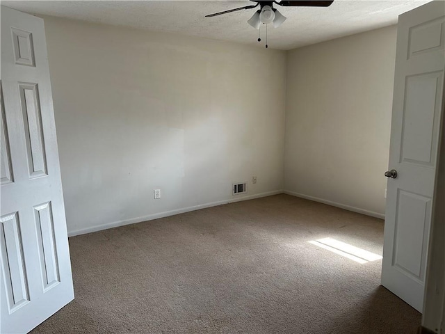 2195 Wilson Rd, Conyers, GA 30012 - unfurnished room featuring a ceiling fan, carpet floors, and baseboards