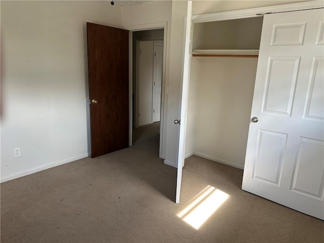 2195 Wilson Rd, Conyers, GA 30012 - unfurnished bedroom with carpet floors, a closet, and baseboards