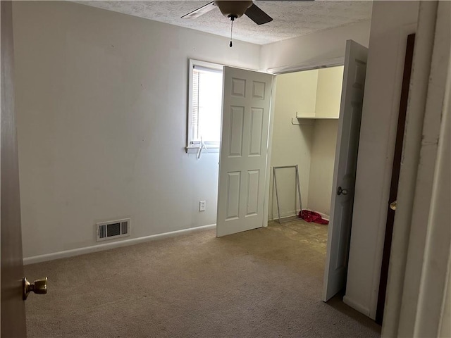2195 Wilson Rd, Conyers, GA 30012 - unfurnished bedroom with a textured ceiling, light carpet, and baseboards