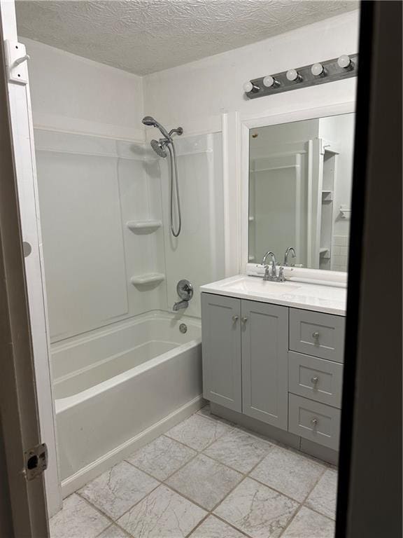2195 Wilson Rd, Conyers, GA 30012 - bathroom with vanity, bathing tub / shower combination, a textured ceiling, and tile patterned floors