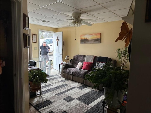 2195 Wilson Rd, Conyers, GA 30012 - carpeted living area featuring a paneled ceiling and ceiling fan