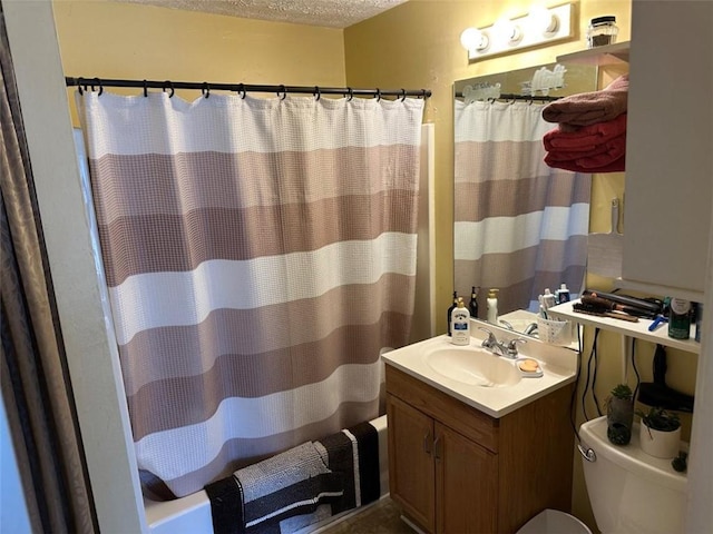 2195 Wilson Rd, Conyers, GA 30012 - bathroom with a textured ceiling, toilet, vanity, and shower / bath combination with curtain