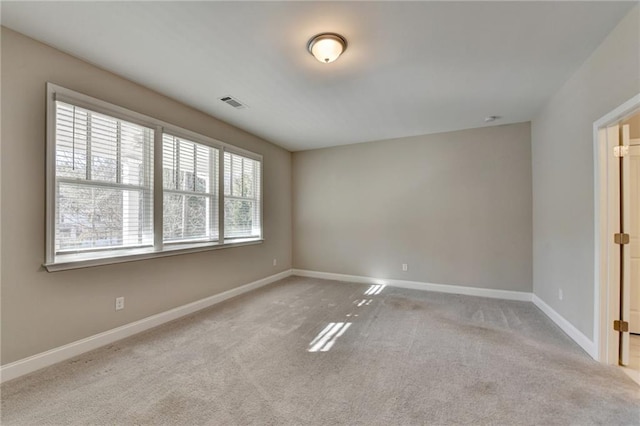 empty room with light colored carpet