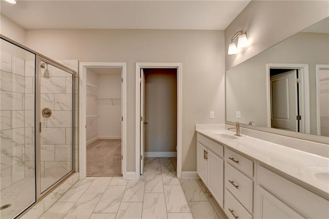 bathroom with an enclosed shower and vanity