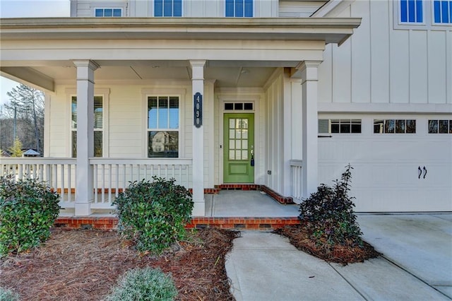 entrance to property with a porch and a garage