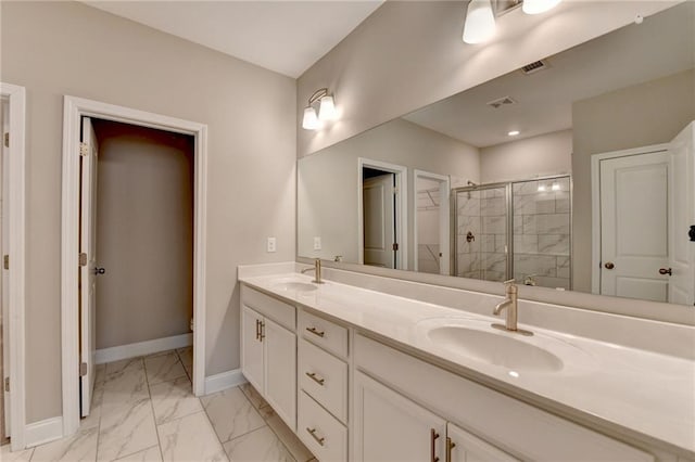 bathroom featuring walk in shower and vanity