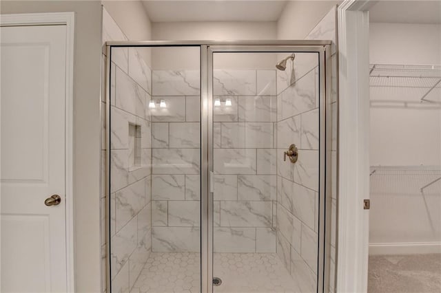 bathroom with a shower with shower door