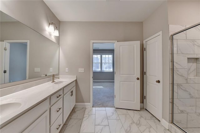 bathroom with walk in shower and vanity