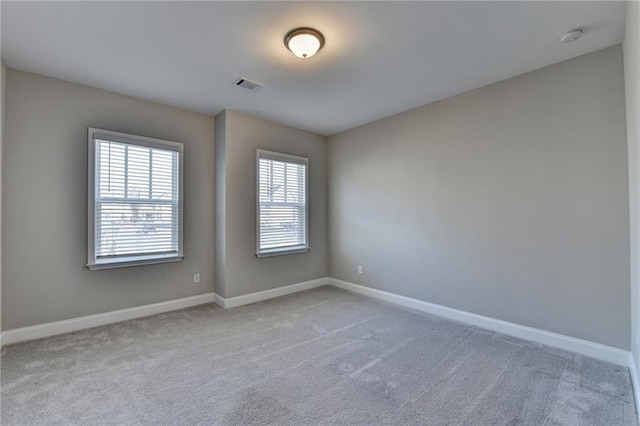 unfurnished room featuring carpet flooring