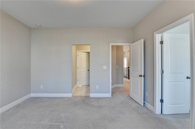 unfurnished bedroom with light carpet