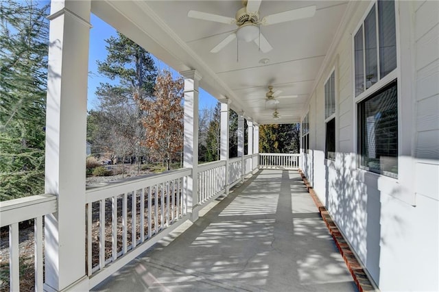 exterior space with a porch and ceiling fan