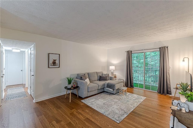 3135 Seven Pines Ct Unit 201, Atlanta, GA 30339 - living area with wood finished floors and a textured ceiling