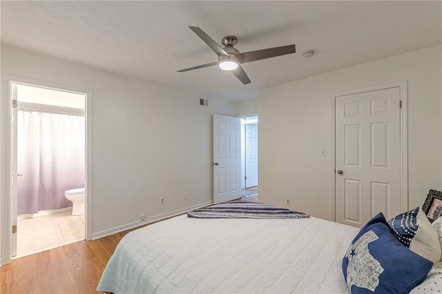 3135 Seven Pines Ct Unit 201, Atlanta, GA 30339 - bedroom featuring light wood-style floors, ceiling fan, and ensuite bathroom
