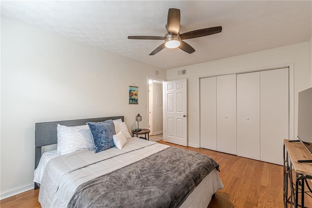 3135 Seven Pines Ct Unit 201, Atlanta, GA 30339 - bedroom featuring light wood-type flooring, a closet, and ceiling fan