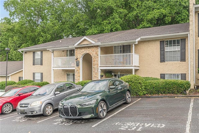 3135 Seven Pines Ct Unit 201, Atlanta, GA 30339 - view of front of home featuring uncovered parking and stucco siding