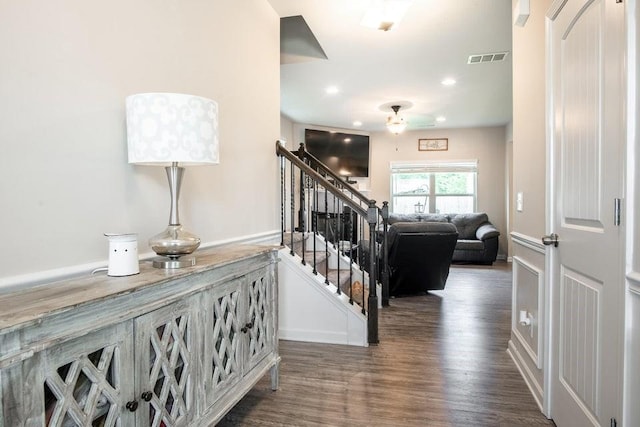 stairway featuring hardwood / wood-style flooring