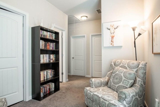 living area featuring light colored carpet