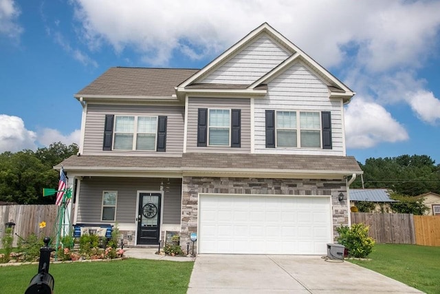 craftsman-style house with a front lawn and a garage