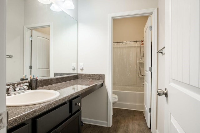 full bathroom with toilet, shower / bath combo, vanity, and hardwood / wood-style flooring