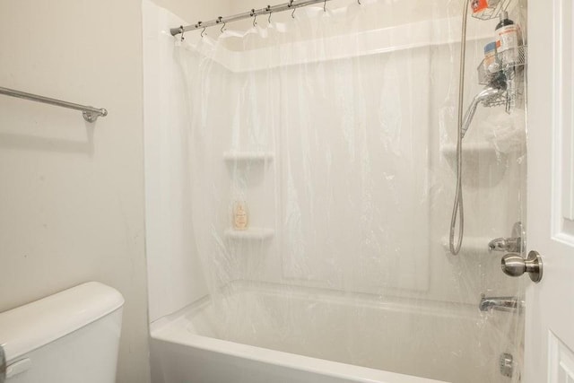 bathroom with toilet and shower / bathing tub combination