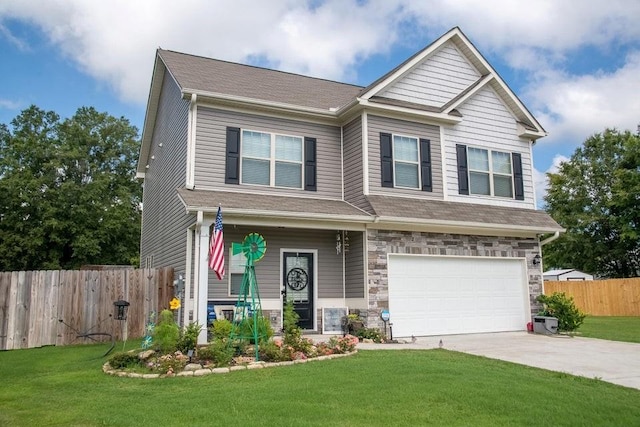 craftsman house featuring a garage and a front yard