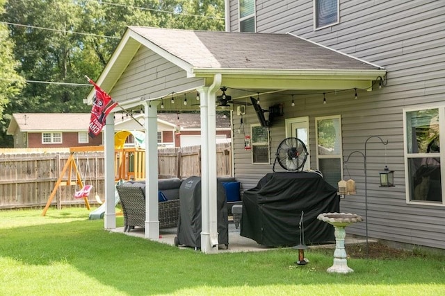 exterior space featuring a grill and a playground