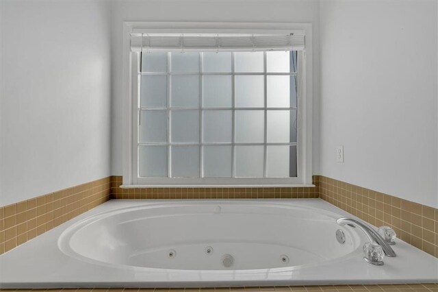 bathroom with a whirlpool tub